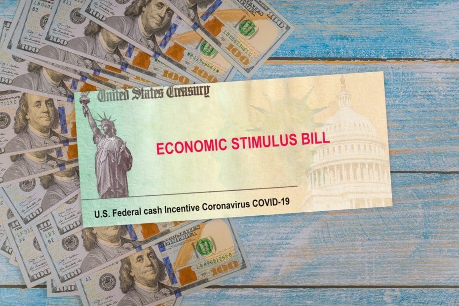 Senate stimulus deal includes individual checks virus economic stimulus plan US 100 dollar bills currency on global pandemic Covid 19 lockdown