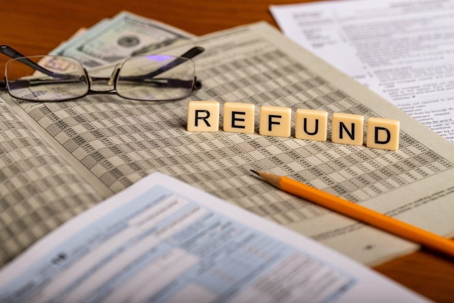 Concept image ot tax refund with forms, pencil, glasses and mone